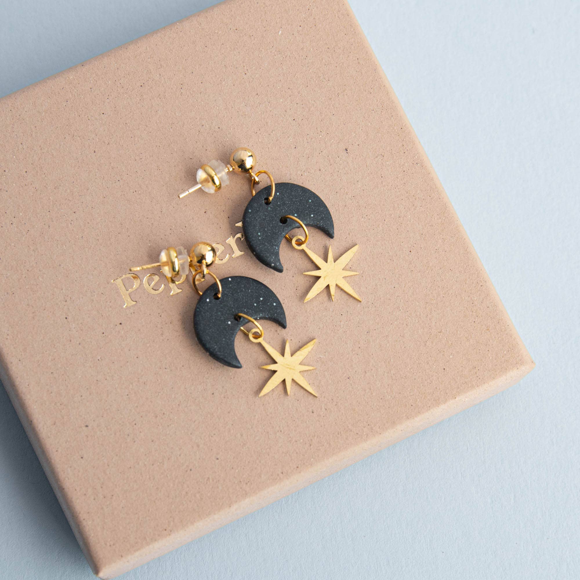 Pepper You Celestial Gold Star Drop Earrings in Midnight Black