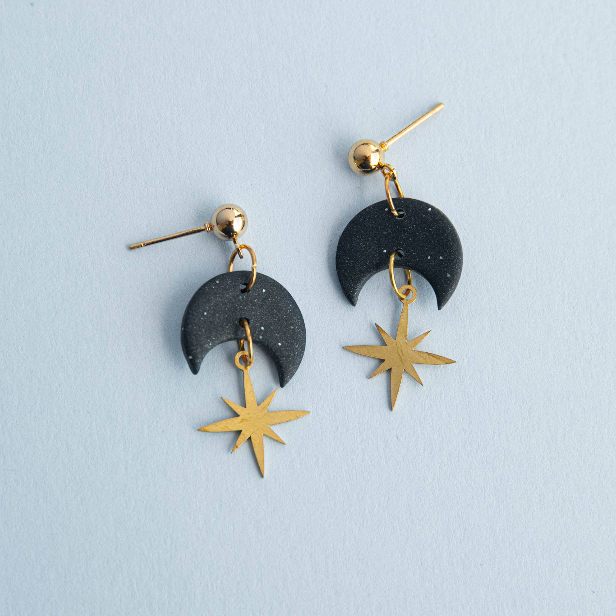 Pepper You Celestial Gold Star Drop Earrings in Midnight Black