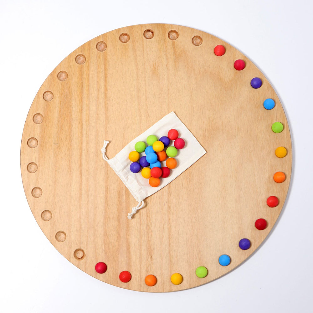 Grimm's Circular Disc and 35 Marbles Year Calender